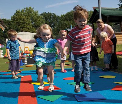 preschoolers playing on obstacle course