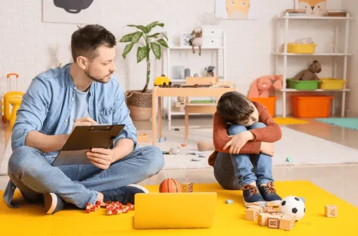 A friendly cat interacting with children in a bright, engaging classroom setting